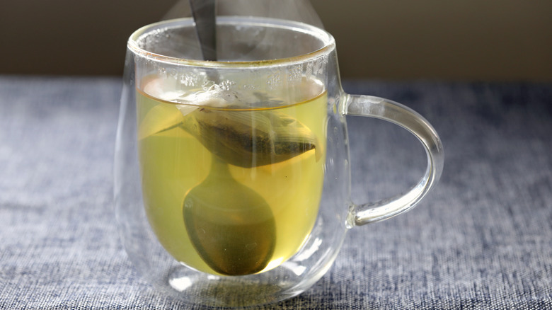 Green tea in glass mug