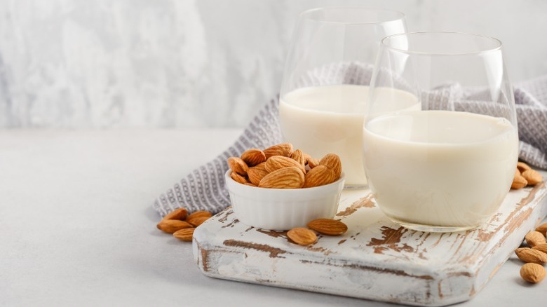 Nut milk in glass almonds