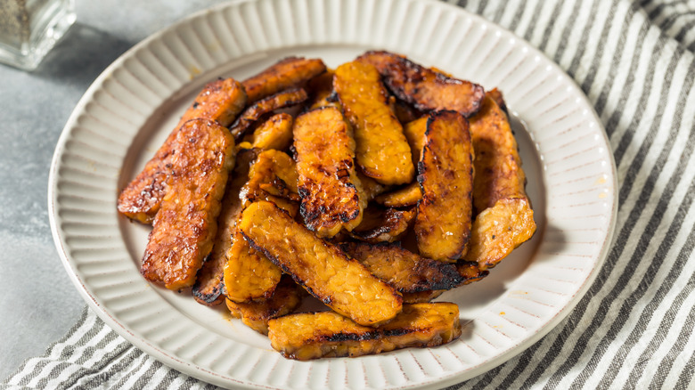 Tempeh bacon on white plate