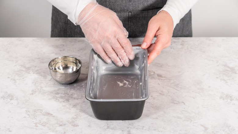 Greasing pan with butter