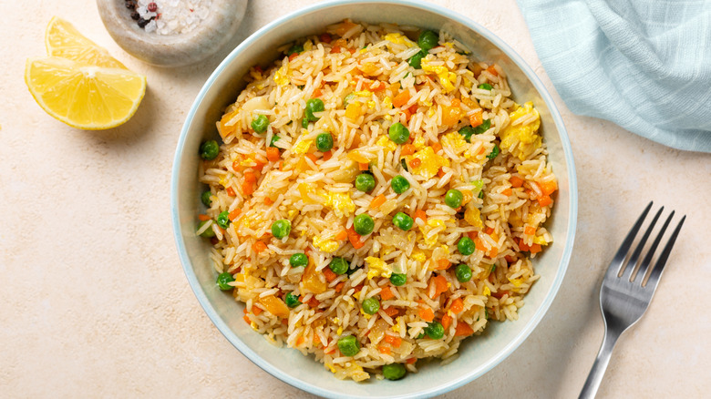 view of a bowl with fried rice with egg and vegetables