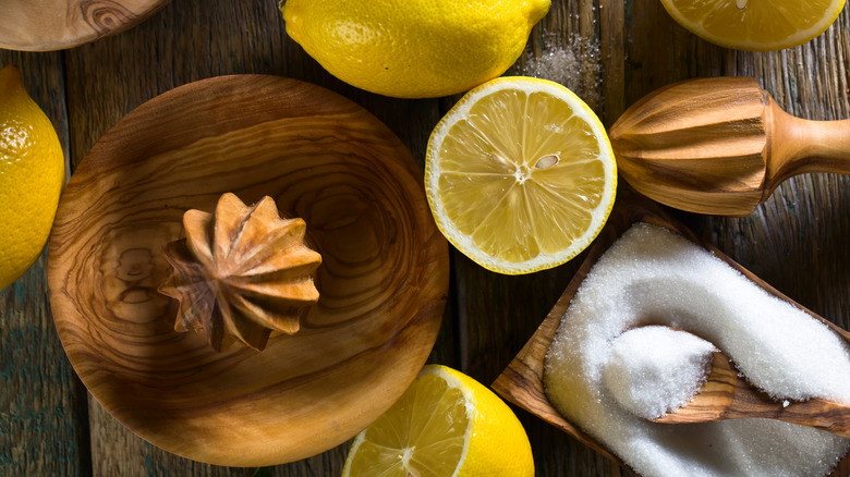 lemons and sugar on wood table