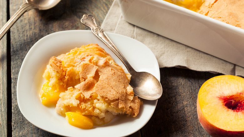 Peach cobbler in white bowl