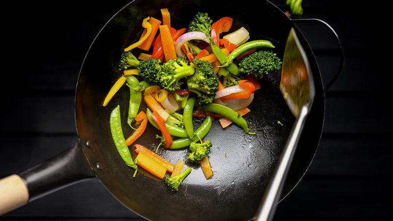 vegetables stir frying in wok