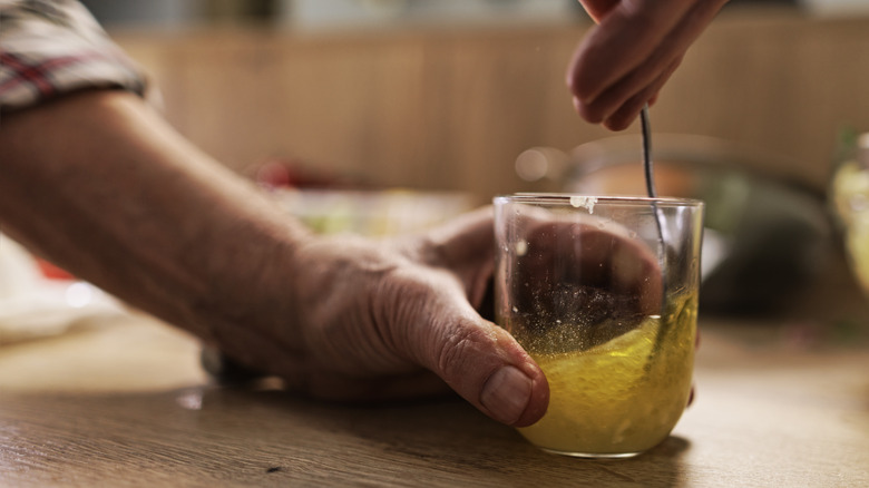 Man making homemade vinaigrette 