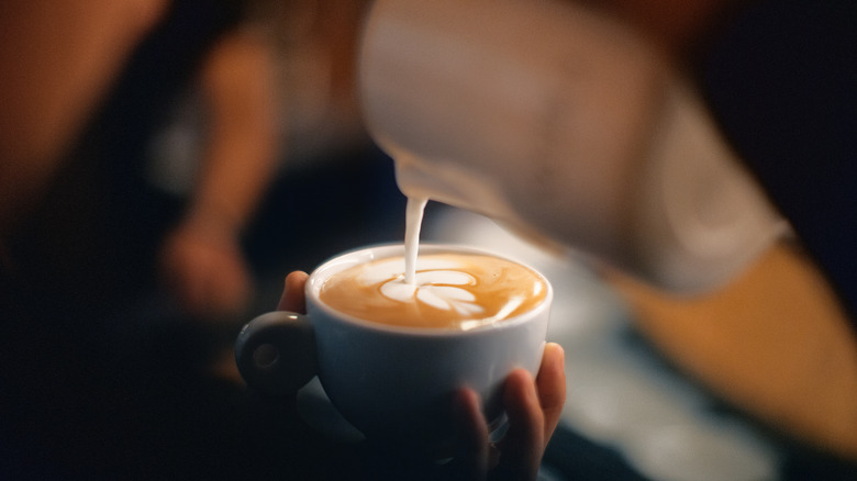Person making latte art