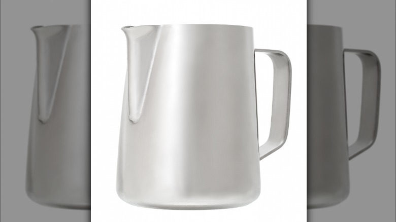 Milk jug on white background