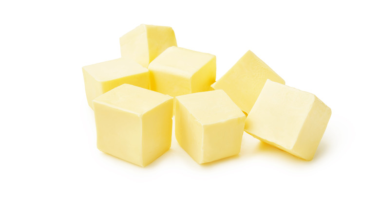 Butter cubes on white background