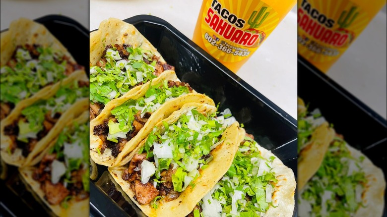 four tacos black tray drink