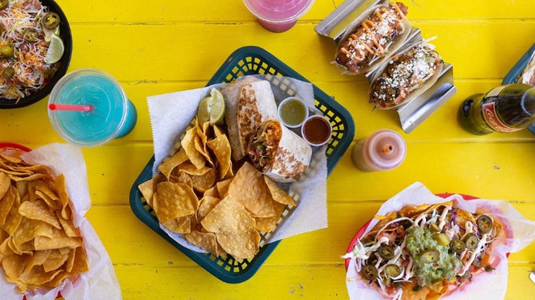 taco and burrito spread on picnic table