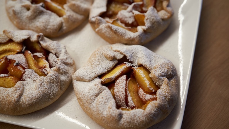 galette with peaches on plate