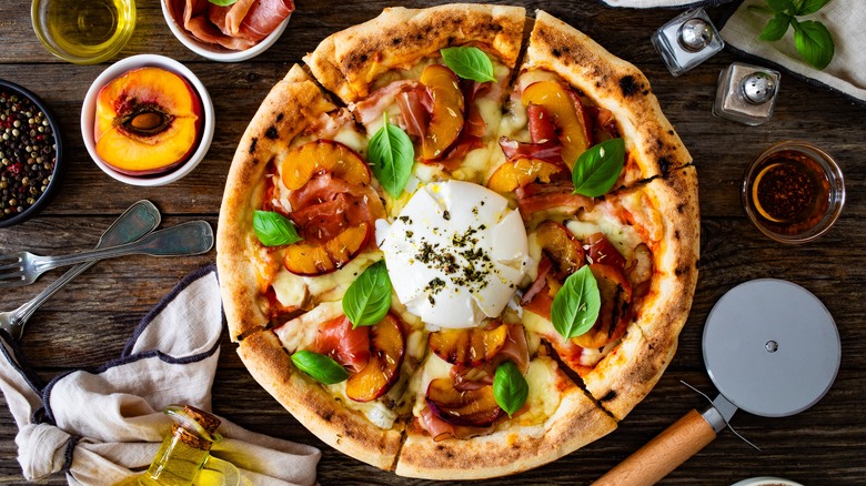 pizza with meat and peaches