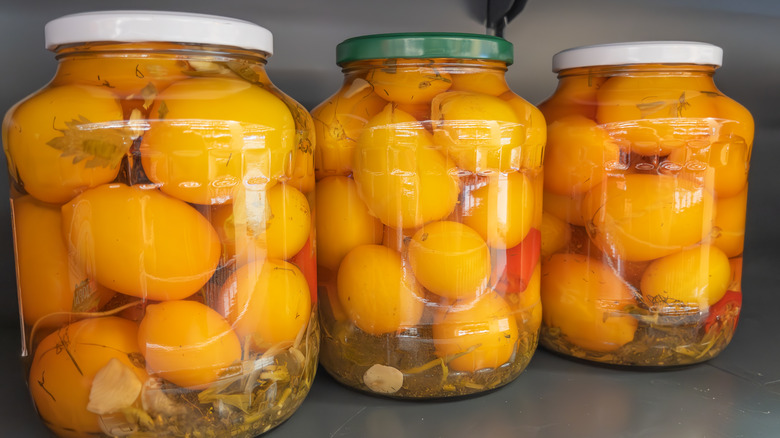 pickled peaches in jars