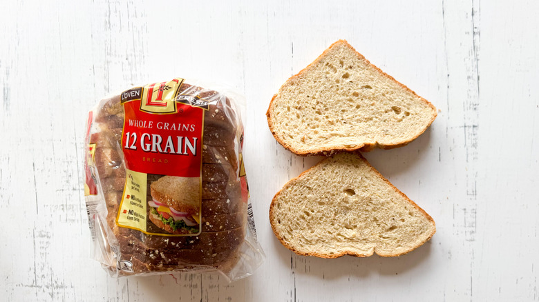 L'Oven bread 12 grain loaf on white surface