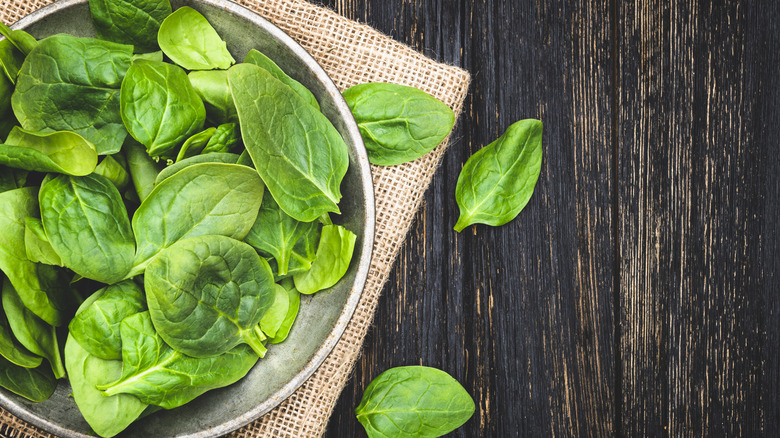 green spinach leaves in bowl 