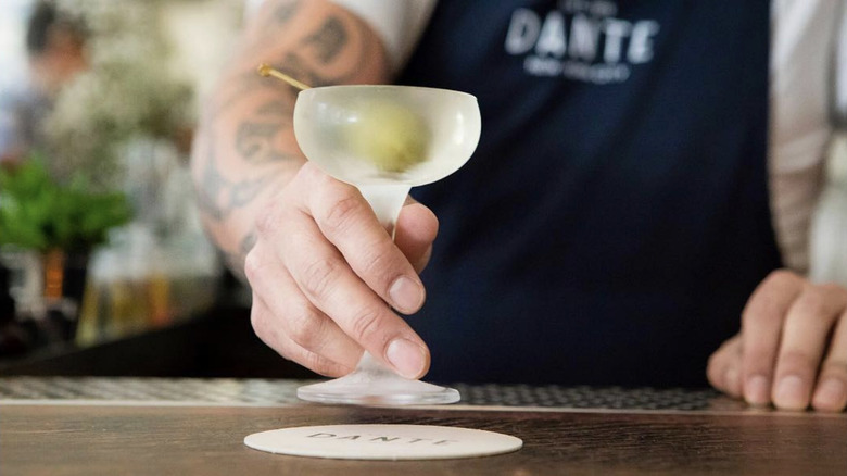 bartender pouring martinis