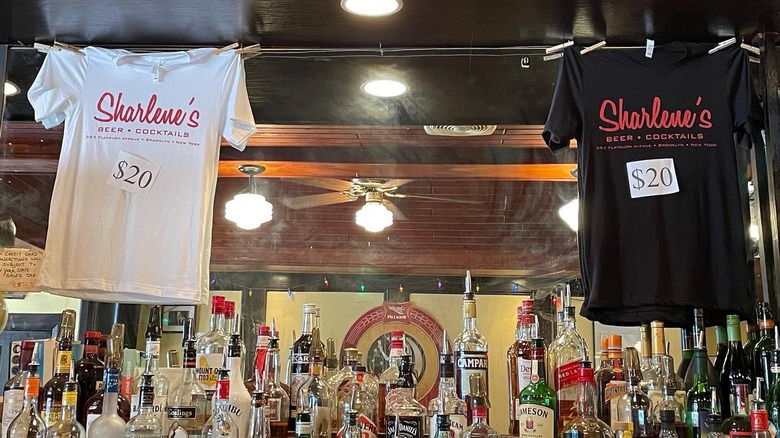 tshirts hanging above the bar at Sharlene's