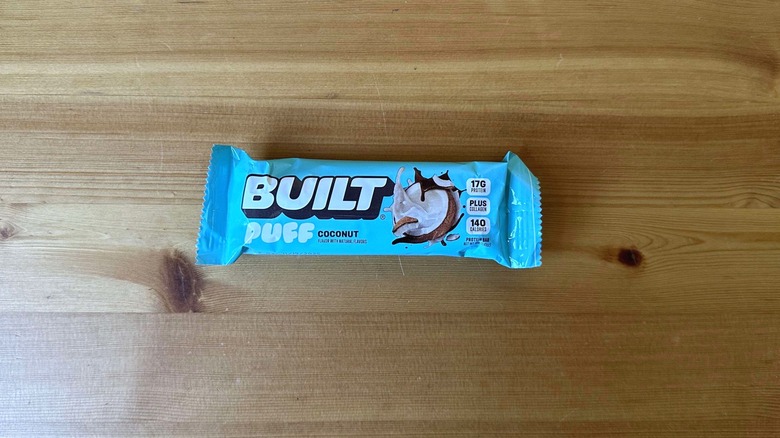 Built Puff protein bar on wooden table