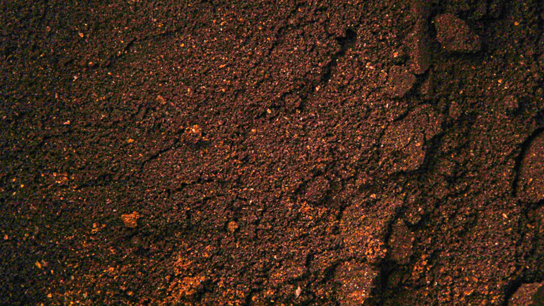 Close-up of finely ground, dark-brown espresso powder