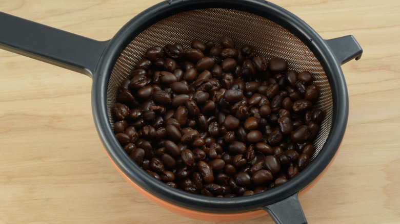 Rinsed canned black beans in strainer colander