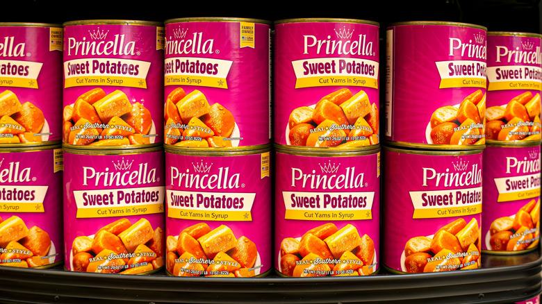 Canned sweet potatoes in syrup on shelf