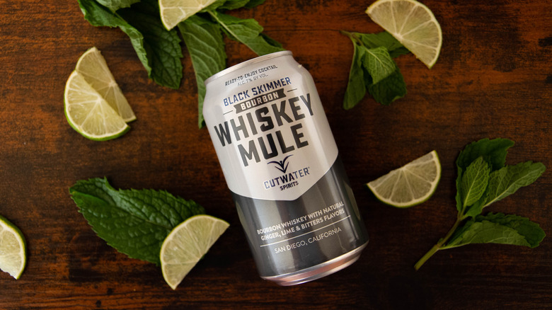 Cutwater Whiskey Mule with limes and mint