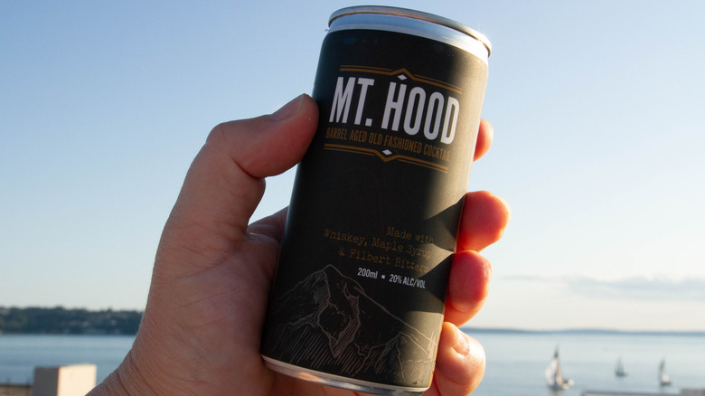 hand holding can of Mt. Hood Barrel Aged Old Fashioned