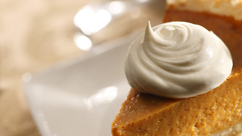 Pumpkin pie with whipped cream