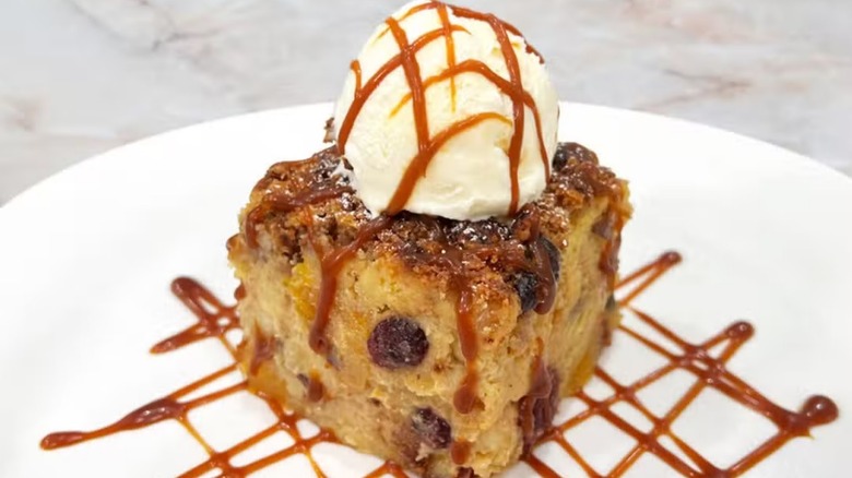 brioche bread apple crisp pudding with ice cream on top