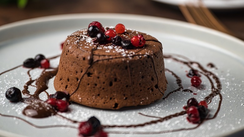 chocolate soufflé with berries plated