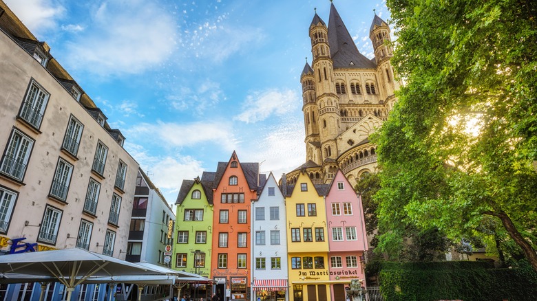 Colorful houses in front of church