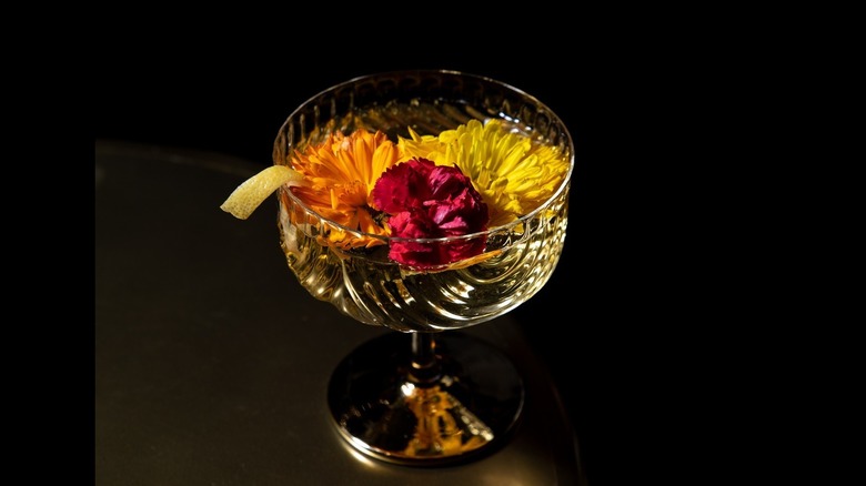 Cocktail with floral toppings