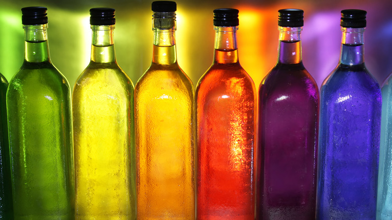 row of multicolored glass bottles