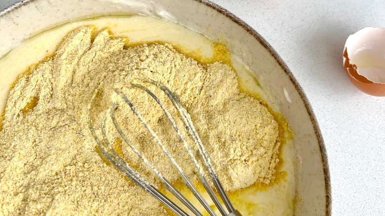 Mixing cornbread in a bowl