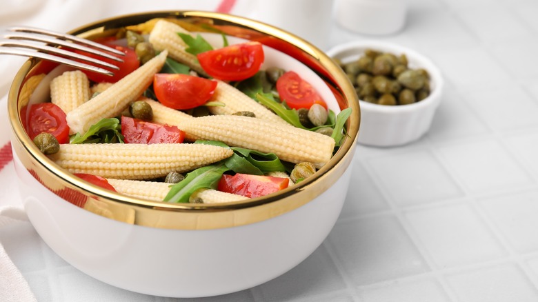 baby corn with tomatoes, arugula, and capers