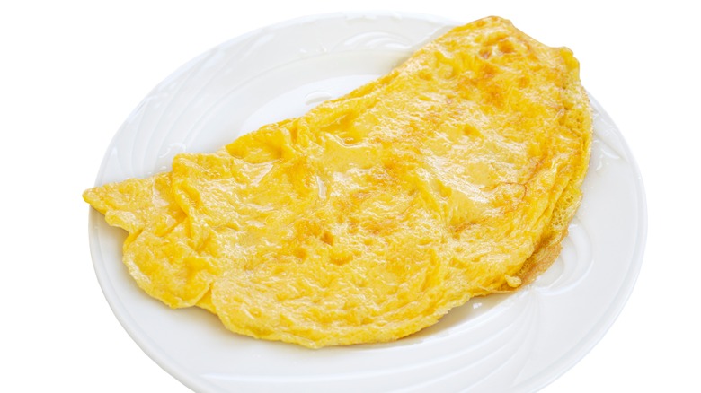 plated omelet in half