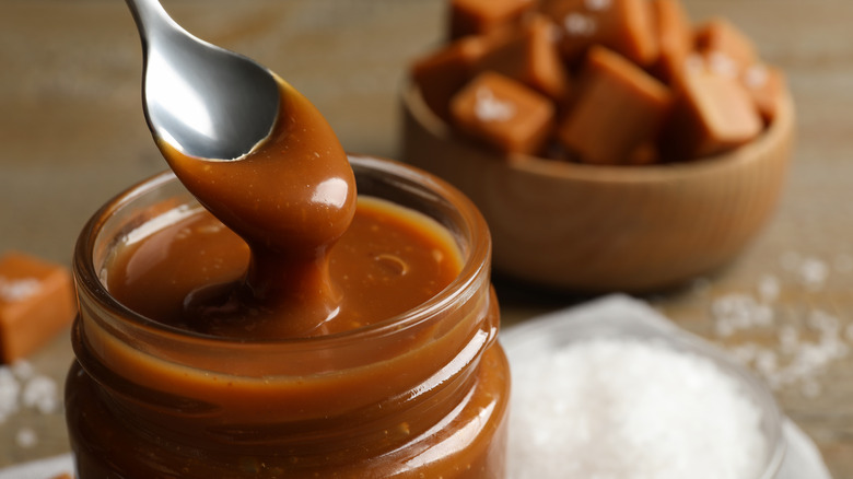 Spoonful of caramel from jar