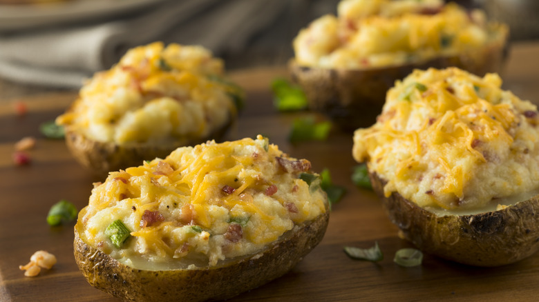 Twice-baked potatoes on cutting board