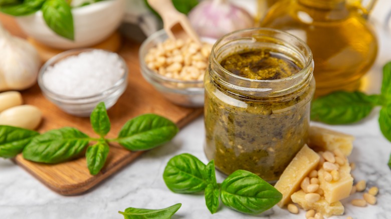 jar of pesto and ingredients