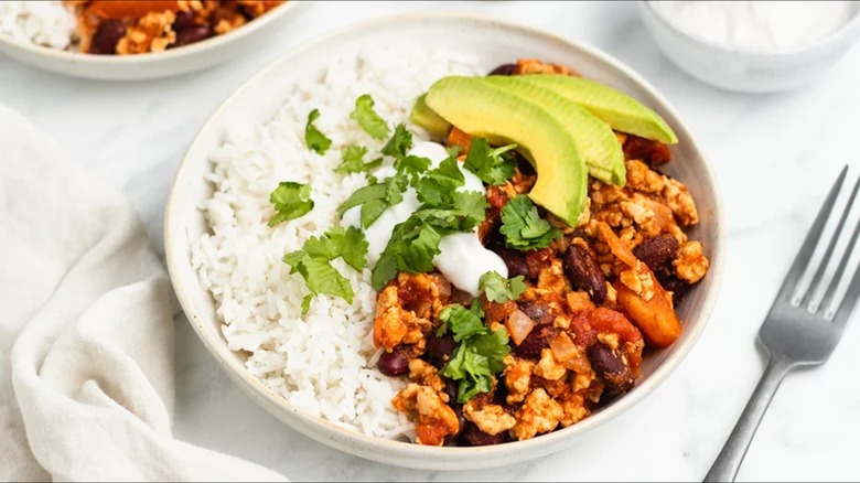 turkey chili on rice in bowl