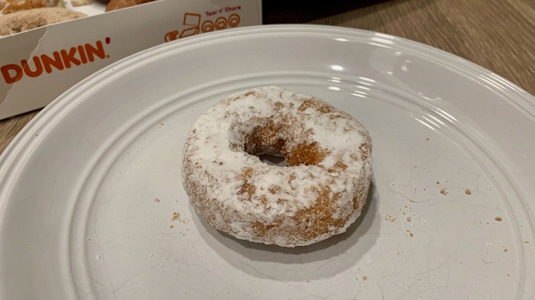 Powdered Dunkin' Donut on plate