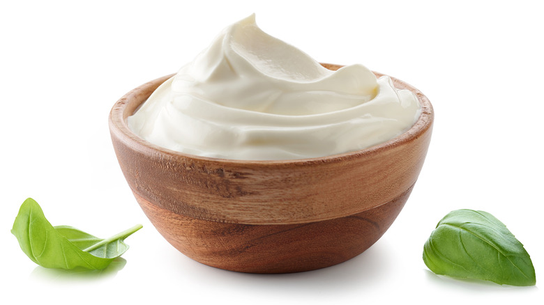 White cream in wooden bowl 