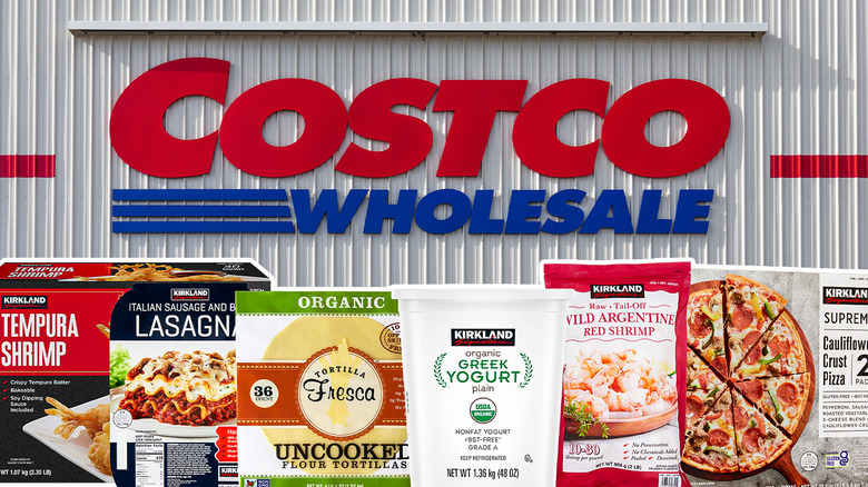 Costco Wholesale sign on warehouse exterior with different food products in front