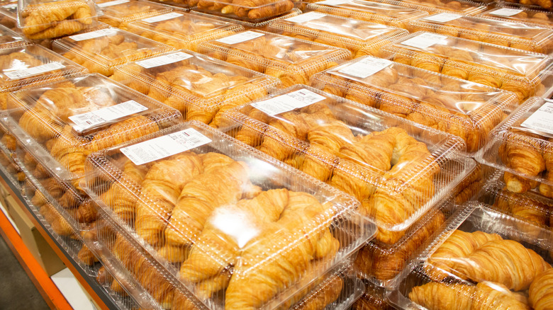 A view of several packages of Kirkland Signature bakery croissants piled up