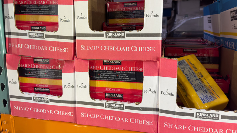 A view of several packages of Kirkland Signature sharp cheddar cheese in boxes
