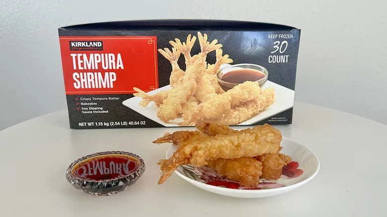 Box and plate of Kirkland tempura shrimp with dipping sauce on table
