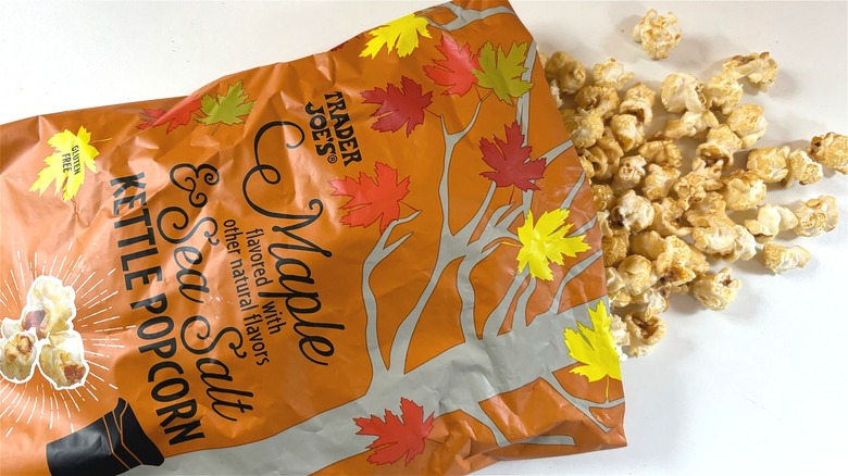 trader joes maple sea salt kettle popcorn spilling out of bag onto table