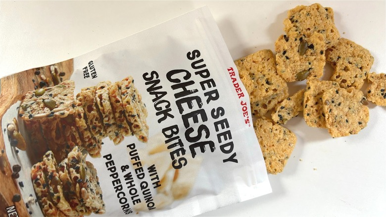 trader joe's super seedy cheese snack bites spilling out of bag on table