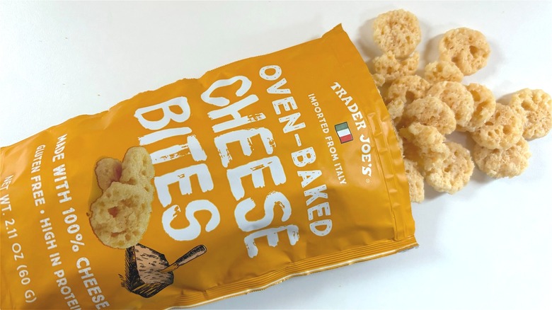 traer joes oven baked cheese bites spilling out of bag on table