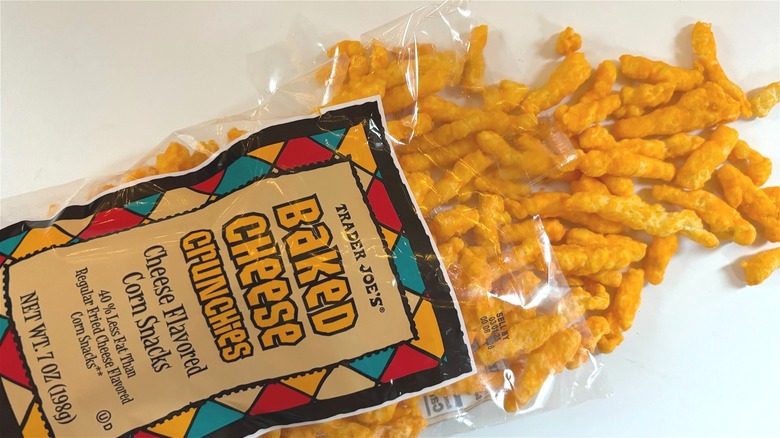 trader joes baked cheese crunchies spilling out of bag onto table